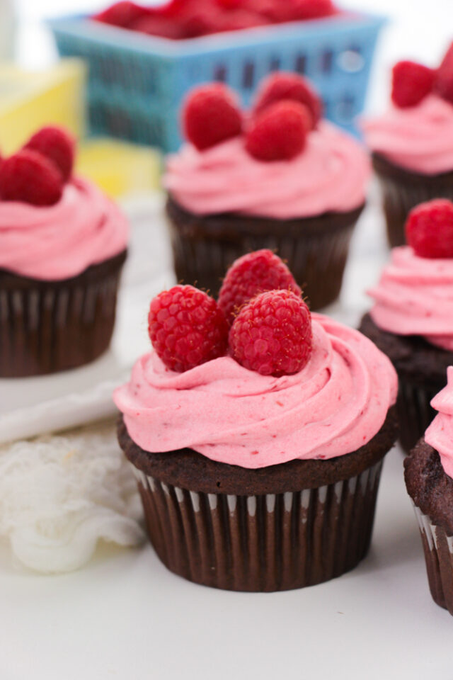 Moist Chocolate Cupcakes Topped With Fresh Raspberry Buttercream Frosting